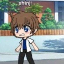 an anime character is standing on the street with his hands in his pockets and looking at something