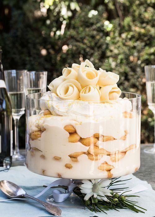 a cake sitting on top of a table covered in frosting