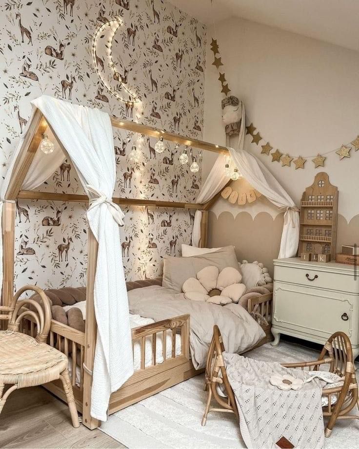 a child's bedroom with a canopy bed and wooden furniture