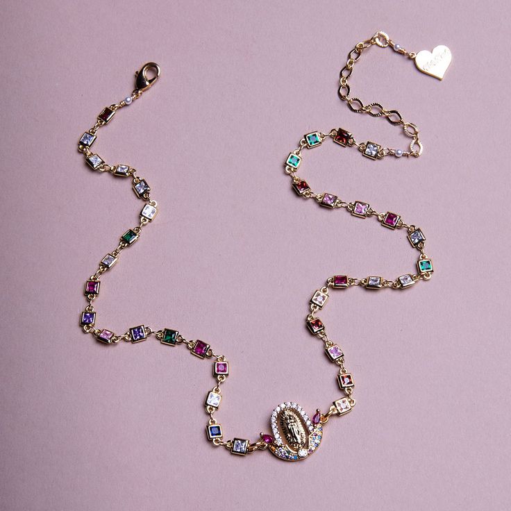 Cubic zirconia chain with rainbow La Virgen pendant. *14"-16" Adjustable (Sizes Available) *18K Gold Plated *Handmade in Los Angeles Face Jewellery, Rainbow Jewelry, Rainbow Necklace, Golden Flower, Nameplate Necklace, Rainbow Crystal, Jewelry Essentials, Hand Chain, Bead Charm Bracelet