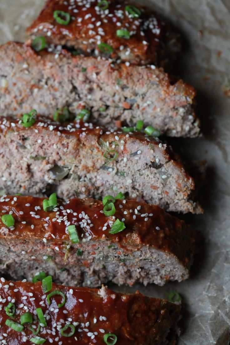 meatloaf with sesame seeds and green onions on top