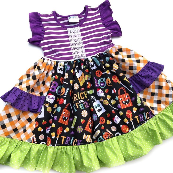 "Our Halloween Trick or Treat Platinum party dress is fashioned for Halloween parties, October events, & memory making. Fashioned in our knit flutter style bodice & a cotton full ruffle skirting, perfect for wowing the crowd! Custom designed from a delightful mix of prints that please & colors that pop. Great for Halloween school parties, October birthday parties, portraits, gift giving,& everyday wear! All designs are tagged in the even sizes. Dress: Size/length: 12mo: 17\" 2: 21\" 4: 24\" 6: 2 Cute Halloween Ruffle Dresses, Cute Ruffled Halloween Dresses, Short Sleeve Ruffled Dresses For Halloween, Short Sleeve Dresses With Ruffles For Halloween, Multicolor Halloween Costume Party Dress, Multicolor Costume Dresses For Halloween, Fun Halloween Costume Dress, Fun Fitted Halloween Dress, Fun Halloween Costume Party Dresses