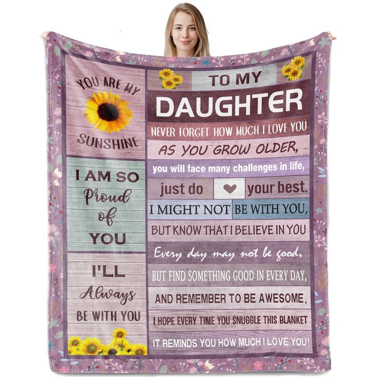 a woman holding up a blanket with the words to my daughter and sunflowers on it