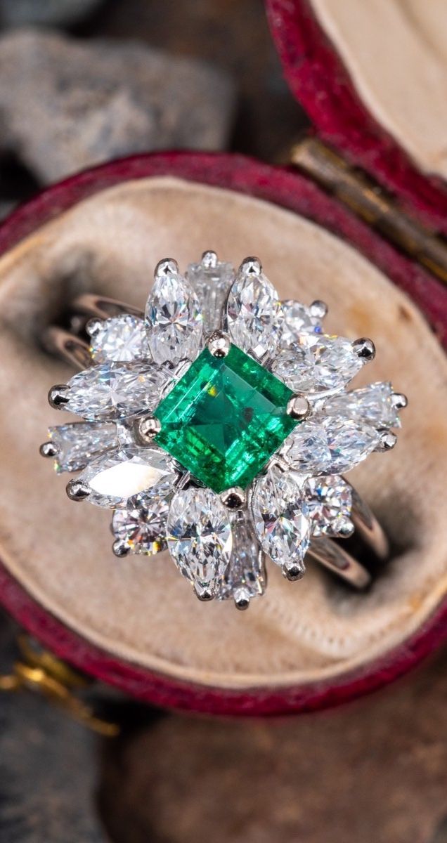 Elegant Marquise Emerald Ring With Center Stone, Luxury Cluster Emerald Ring, Luxury Marquise Emerald Ring With Diamonds, Classic Cluster Emerald Jewelry, Platinum Cluster Emerald Ring, Green Platinum Emerald Ring With Cluster Shape, Elegant Marquise Emerald Ring, Wedding Emerald Cut Emerald Ring With 17 Jewels, Emerald Cut Emerald Ring With 17 Jewels For Wedding