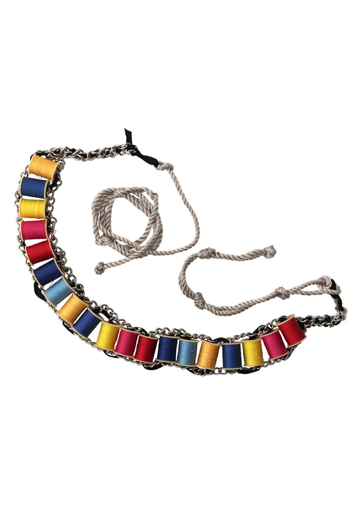 a multicolored necklace on a chain with a cord attached to the clasps