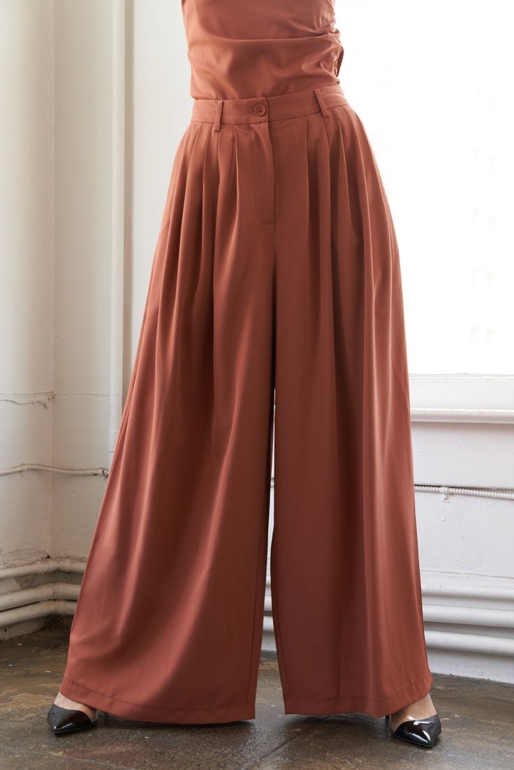 A solid woven wide leg pant with front closure, pleating details and pockets Details: Self : 100% Polyester Size & Fit - Model is 5`9" And Wearing Size Small- Measurements Taken From Size Small- Approx. Length: 44" Wide Leg Pants With Accordion Pleats, Wide-leg Pants With Accordion Pleats For Work, Accordion Pleats Wide-leg Work Pants, Summer Wide Leg Bottoms With Accordion Pleats, Spring Pleated Ankle-length Wide Leg Pants, Pleated High-waist Wide Leg Pants, Spring Pleated Full Length Pants, Pleated Full-length Wide Leg Work Pants, Wide Leg Bottoms With Accordion Pleats For Summer