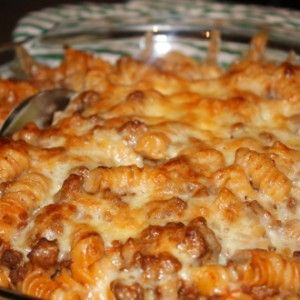 a casserole dish with meat and cheese on it, ready to be eaten