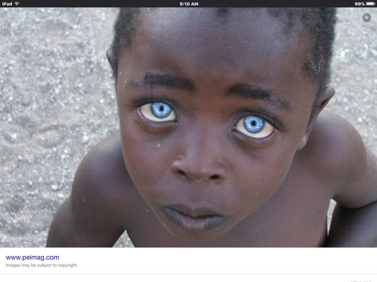 a young boy with blue eyes stares directly at the camera in front of an instagram page