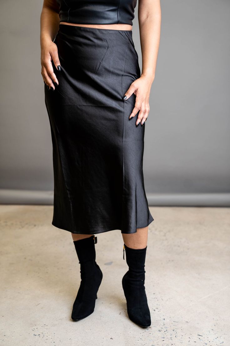 A slip skirt is a wardrobe must-have. This classic is the perfect wardrobe essential that can go from day to night depending on your vibe. Wear it with heels for the perfect date night look, or wear it with sneakers to transition it to the perfect errand skirt. FEATURES Zipper side closure Elastic waist Light stretch SIZE & FIT Model is wearing a size: Small. True to size. DETAILS 100% Polyester CARE Hand wash cold. Do not bleach. Line dry. Iron low. Fitted Midi Length Skirt For Date Night, Stretch Skirt For Date Night, Evening Fall Pencil Skirt, Chic Evening Pencil Skirt For Fall, Chic Fall Evening Pencil Skirt, Relaxed Flared Skirt For Date Night, Chic Evening Pencil Skirt, Sleek Pencil Skirt For Night Out, Chic Knee-length Pencil Skirt For Night Out