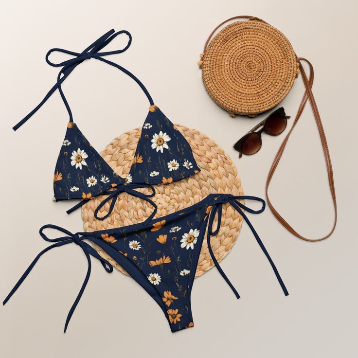 The trendy navy blue triangle bikini set with meadow flowers gives bohemian vibes. The lining is navy blue. Perfect boho-chic bikini is available in sizes up to 6XL. Straps can be tied in multiple ways. This design on the bikini top and bottom are also sold separately. Please check the sizing chart between the listing photos. In case of any questions feel free to message me. Item is custom-made per order. The bikini was designed by me and it's made by Printful in their production facilities in E Summer Navy Triangle Top Swimwear, Navy Summer Swimwear For Beach Party, Navy Swimwear For Summer Beach Party, Navy Triangle Top Swimwear For Summer, Navy Swimwear For Beach Party In Summer, Summer Style Navy Triangle Top Swimwear, Navy Triangle Top Swimwear For Beach, Navy Swimwear For Beach Party, Navy Swimwear For Beach Party Season