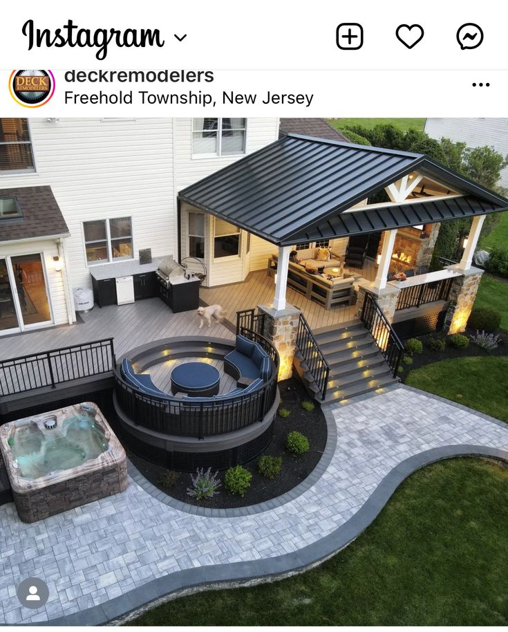 an aerial view of a backyard with hot tub and patio area in the middle of it