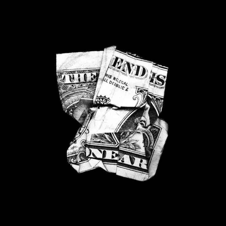 two stacks of twenty dollar bills sitting on top of each other in black and white