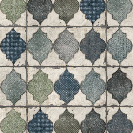 an old tiled floor with blue and green tiles on it's sides, as well as dots in the middle