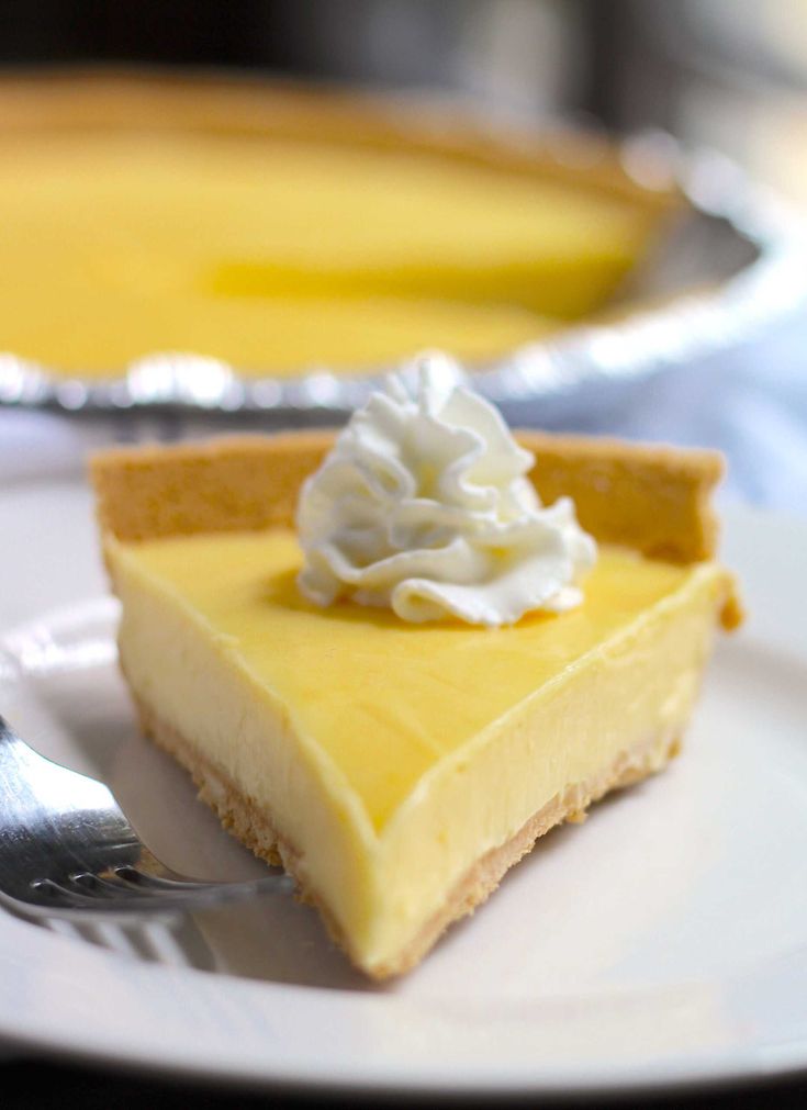 a slice of cheesecake on a plate with a fork