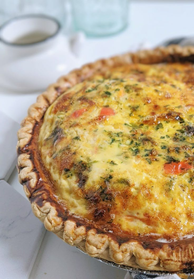 a quiche pie sitting on top of a white counter