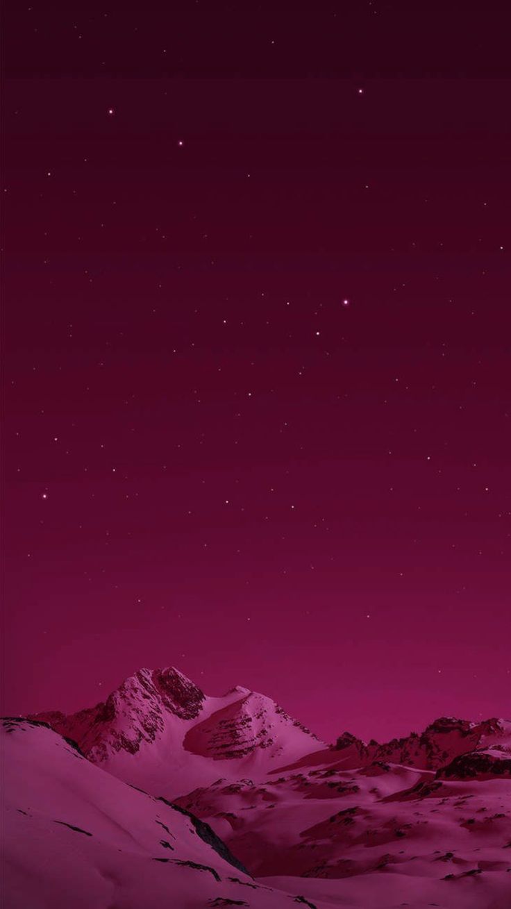 the night sky is pink and purple with stars above mountains in the distance are snow covered hills