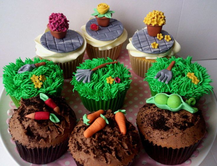 cupcakes decorated with green frosting on a plate