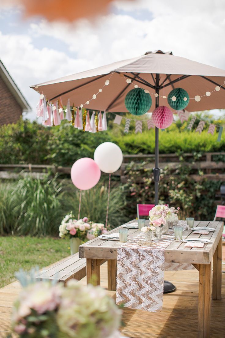 an outdoor table set up for a party