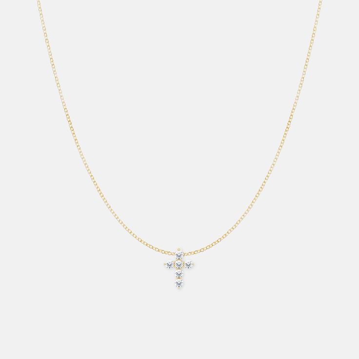 A petite diamond cross necklace to be layered with your favorite necklaces or worn by itself. This makes a great baptism or graduation gift! cross measurements approx. 9x7 mm available in 14k solid yellow, rose and white gold 6 petite genuine diamonds, each measuring 1.8mm for a total of 1/6 CTW (diamond clarify/color: I1, G-H) dainty 1.1mm chain available in 14, 16 and 18 inch length (optional) These are made to order, so please allow 10-14 business days for construction and arrival to your des 14k Gold Cross Necklace With Delicate Chain, Elegant Cross Pendant Necklace With Clavicle Chain, Elegant Pendant Cross Necklace With Clavicle Chain, Classic Clavicle Chain Necklace With Cross Pendant, Classic Cross Pendant Clavicle Necklace, Fine Jewelry Crucifix With Diamond Accents, Cross Necklace With Single Cut Diamonds As A Gift, Brilliant Cut Cross Pendant Necklaces, Cross Necklace With Single Cut Diamonds For Gift