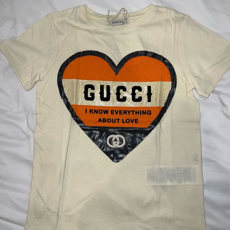 Gucci Kids Tshirt Size 8 New With Tags - Never Used 100% Authentic Will Ship Within 24 Hrs Serious Offers Only ~ Gucci Cotton Tops With Logo Print, Gucci Cotton Tops With Letter Print, Trendy Gucci Crew Neck T-shirt, Gucci Cotton Graphic Print T-shirt, Gucci Cotton T-shirt With Graphic Print, Gucci Cotton T-shirt With Logo Print, Gucci Cotton Top For Streetwear, Gucci Cotton Graphic Tee, Gucci Letter Print Tops For Streetwear