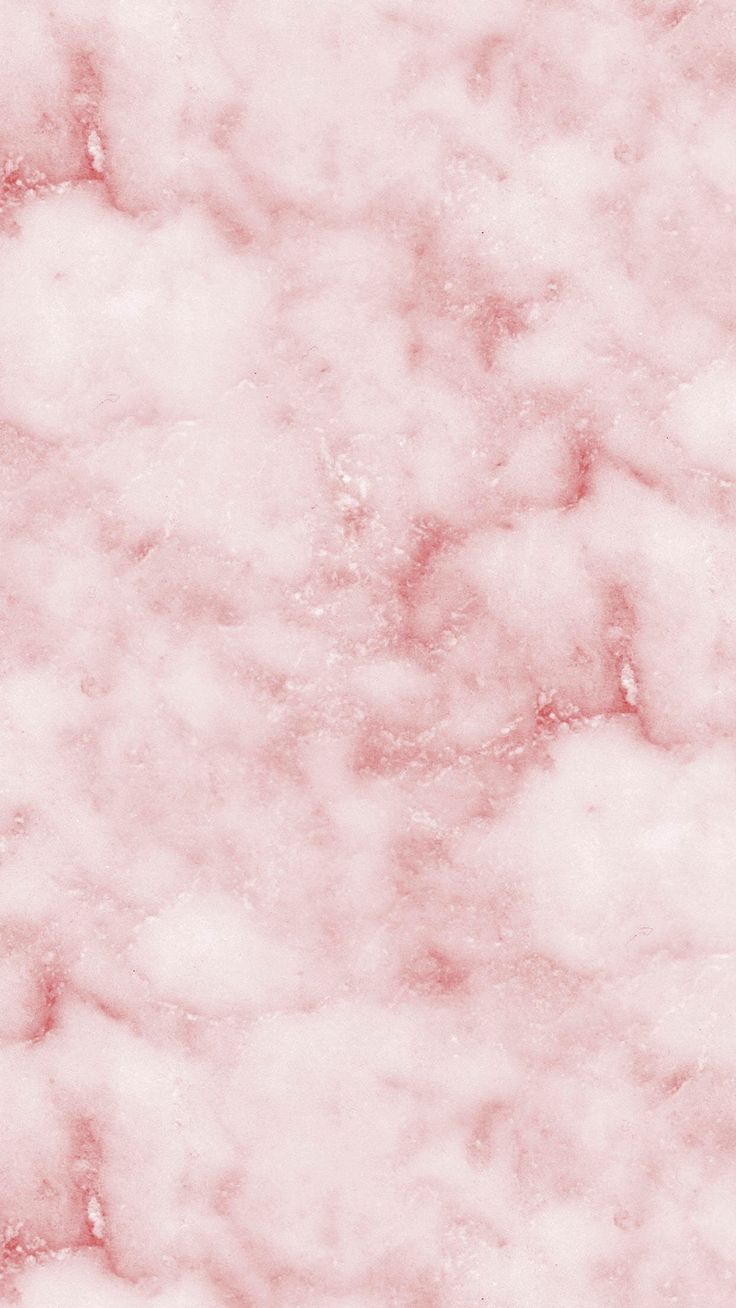 pink marble textured background with white and black dots in the center, top view