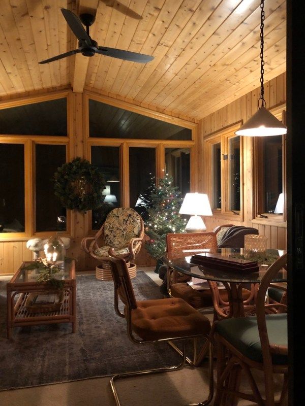 a living room filled with furniture and a ceiling fan