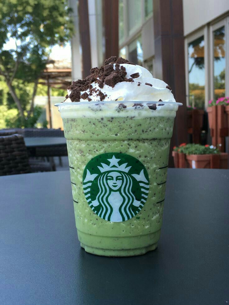 a starbucks drink with whipped cream and chocolate chips