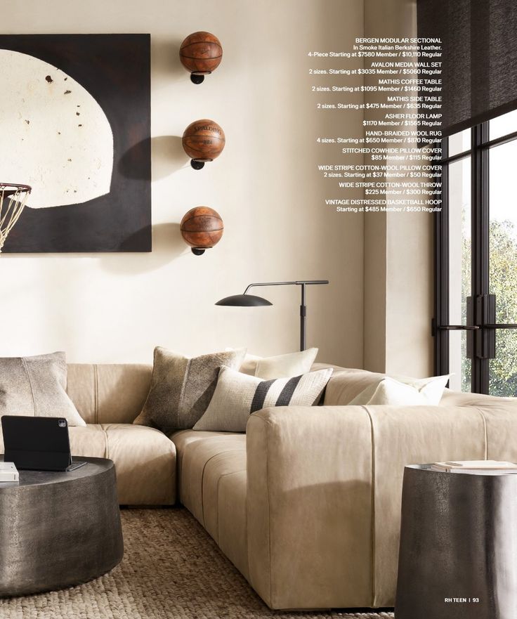 a living room filled with furniture and a basketball hoop hanging on the wall above it