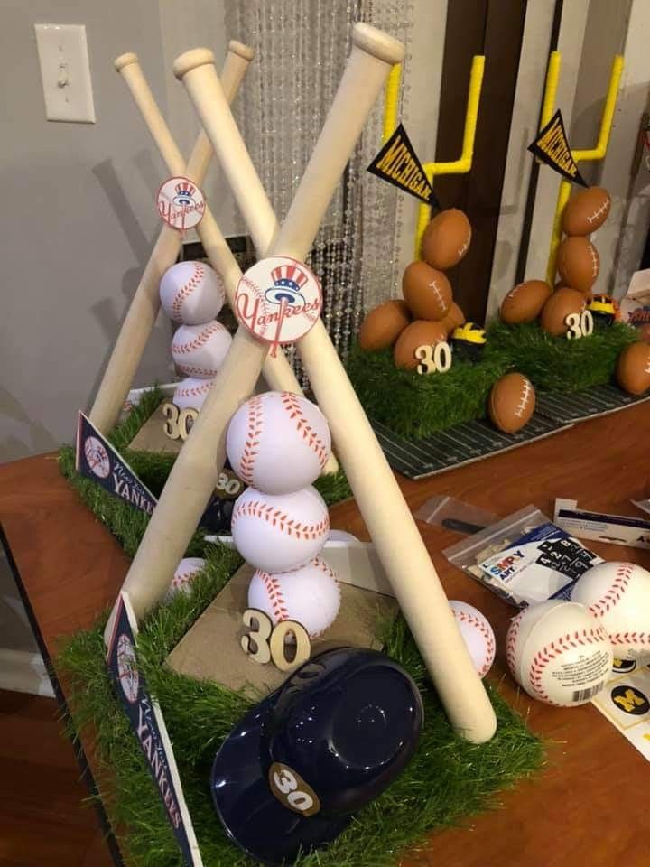 some baseball bats and balls are on the table