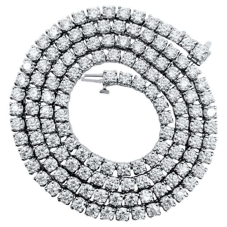 This necklace is made of 14-karat white gold. The diamonds on it weigh 26 carats and have very, very slight (VVS) clarity and are in an H color. These diamonds are all natural and mined from the earth. They are cut in a round brilliant style, making them sparkle. The necklace is stunning and high-end, suitable for both men and women. Key Features: Metal: 14k white gold. Diamonds: 26CWT. VVS clarity. H color. 100% natural earth mined diamonds. Round brilliant cut diamonds. Gorgeous high end tenni Diamond And Pearl Necklace, Vvs Diamond, Diamond Tennis Necklace, Unisex Necklace, Expensive Jewelry, Tennis Necklace, Antique Necklace, Modern Necklaces, Natural Earth