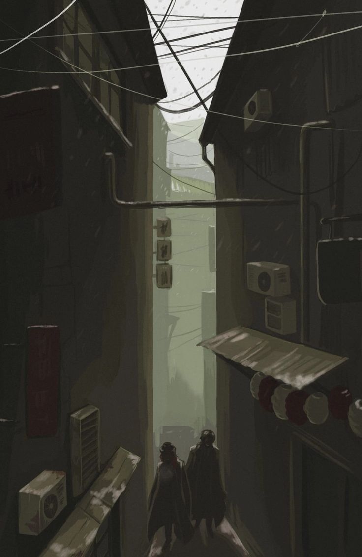 two people are walking down an alley way in the city with wires above their heads