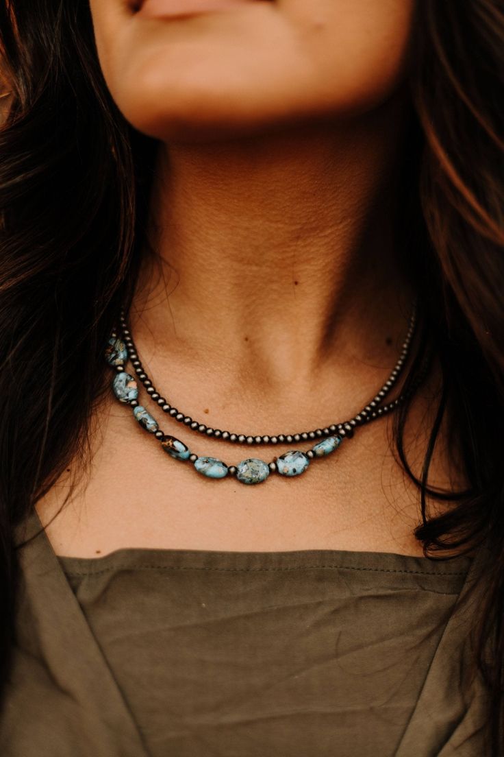 Turquoise is a cowgirl’s best friend, so you need this Turquoise and Pearl Choker! Silver pearls and oval turquoise stones surround this beautiful necklace. Try pairing it with your favorite graphic tee and denim! 15" and 5" extender Antique Turquoise Jewelry, Antler Earrings, Turquoise Wrap Bracelet, Turquoise Choker, Choker Silver, Navajo Pearls, Western Accessories, Layered Chokers, Turquoise Stones