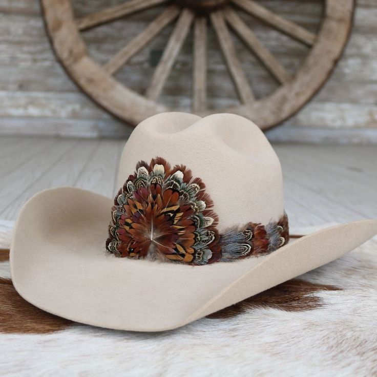 The Rowan (short) is a smaller version of our best selling hat band. Specially designed for small sized hats (6 7/8 and under) and kids hats.  100% Feather * Length: approx. 53cm (not including leather ties) * Width: 2cm * Crest dimensions: 4"w X 3.25"h Western Hat Bands For Country Events, Brown Flat Bill Hat Bands For Kentucky Derby, Adjustable Brown Mini Hat With Short Brim, Brown Adjustable Mini Hat With Short Brim, Adjustable Short Brim Top Hat For Rodeo, Adjustable Fit Flat Brim Hat For Country Events, Country Style Flat Bill Hats For Rodeo, Adjustable Brown Mini Hat With Flat Brim, Country Style Flat Bill Hat For Country Events