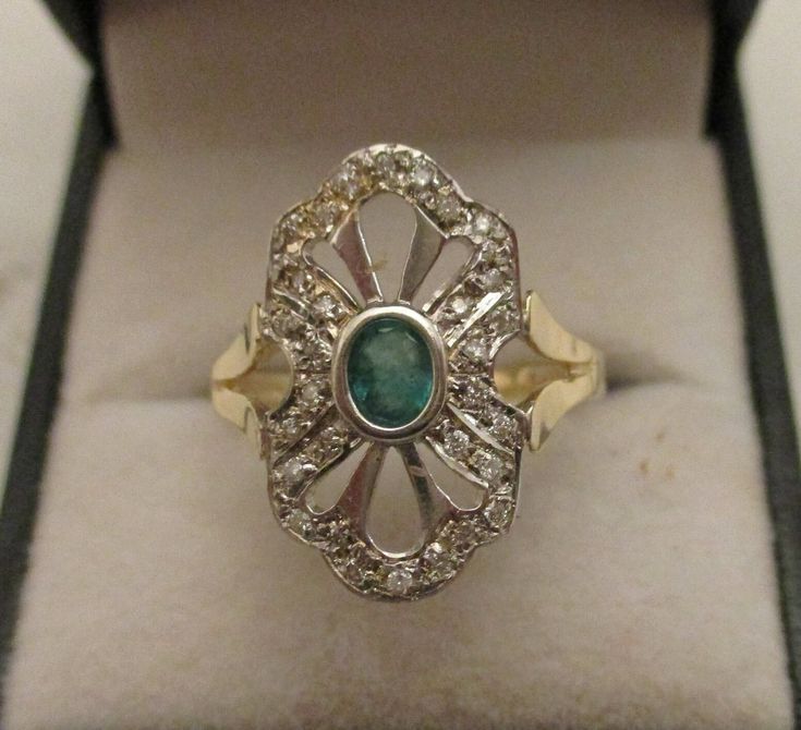 An unique and  exceptional Emerald and Diamond ring, hand made by a professional British jewellery craftsman to the highest standard designed in an  Art Deco style.  This beautiful Ring has a central oval collar set faceted Emerald stone that is surrounded by a  thirty clear Diamonds, all set into a white 9ct  gold Art Deco style   framework.  The Emerald and Diamond  framework  is presented on a 9ct yellow gold shank with detailed divided shoulders . Size .... O. New. Heirloom Style Oval Emerald Ring With Diamond Cut, Heirloom Oval Emerald Ring With Diamond Cut, Oval Stone Setting Jewelry For Formal Occasions, Unique Oval Gemstones With Stone Setting, Antique Oval Emerald Ring For Anniversary, Art Deco Oval Rings For Formal Occasions, Oval Art Deco Rings For Formal Occasions, Formal Oval Ring With Stone Setting, Formal Oval Rings With Stone Setting