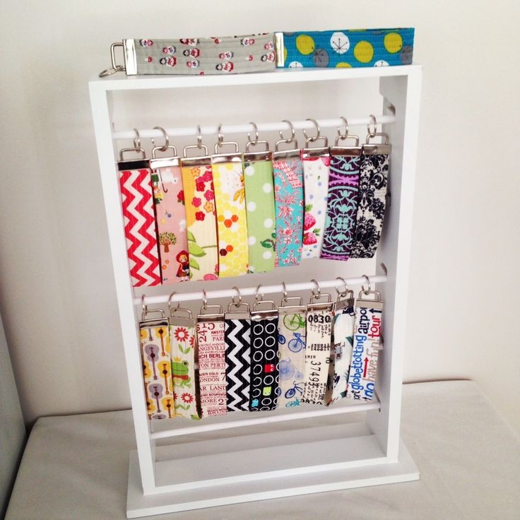 a shelf that has many different types of fabric on it