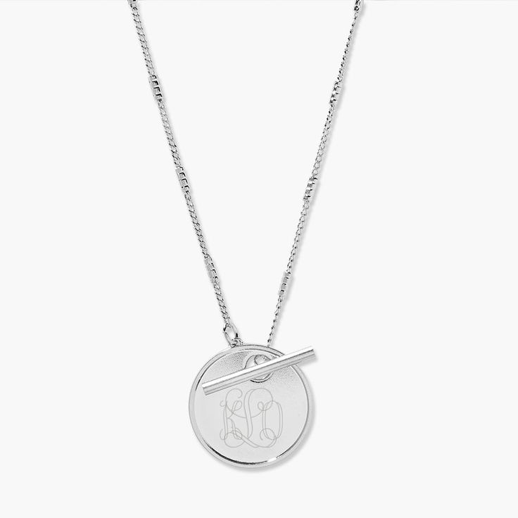 An engravable disc pendant is the centerpiece of our stylish toggle monogram necklace. This is the perfect everyday piece for work, play, and everywhere in between. Available in 14k gold plated, rhodium plated or 14k rose gold plated brass Pendant size: 7/8" 18" curb barrel chain Toggle closure Made in the USA With engraving this item is FINAL SALE SKU: BYN1171 Personalized Elegant Round Medallion Necklace, Everyday Round Pendant Toggle Necklace, Classic Sterling Silver Necklace With Toggle Clasp, Minimalist Toggle Necklace With Round Pendant As Gift, Classic Necklace With Engraving Option, Classic Sterling Silver Toggle Necklace, Elegant Sterling Silver Medallion Necklace For Everyday, Minimalist Round Pendant Toggle Necklace For Gift, Elegant Silver Medallion Necklace For Everyday