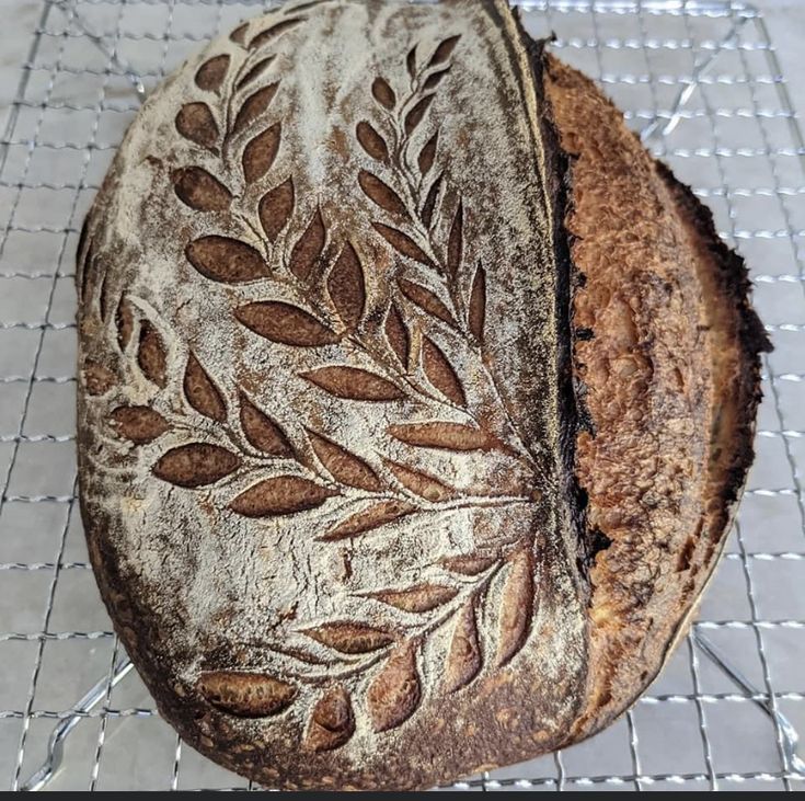 a loaf of bread sitting on top of a cooling rack