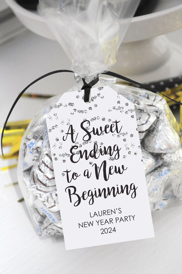 a sweet ending to a new beginning tag on a bag of hersheys for a new year's party