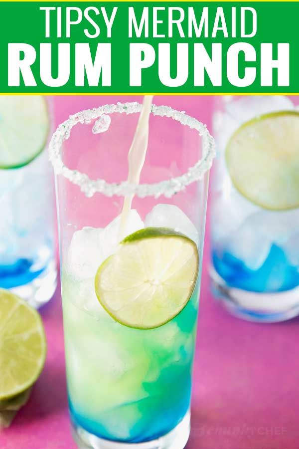 Tipsy Mermaid Rum Punch | Sweet and colorful, this Tipsy Mermaid Rum Punch is a fantastic way to cool down and celebrate in tropical style!  Perfect for a party or casual night in. As tasty as it is beautiful, this Tipsy Mermaid Rum Punch is full of amazing tropical flavors, multiple types of Rum, and gets it’s beautiful Ombré color from Blue Curacao. This is one drink you absolutely need to try, year round! Food Recipes Vegetarian, Mermaid Drink, The Chunky Chef, Summer Drink Cocktails, Bachelorette Drink, Chunky Chef, Rum Punch, Tropical Drink, Summer Drink