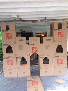 several boxes are stacked on top of each other in an open garage with the roof removed