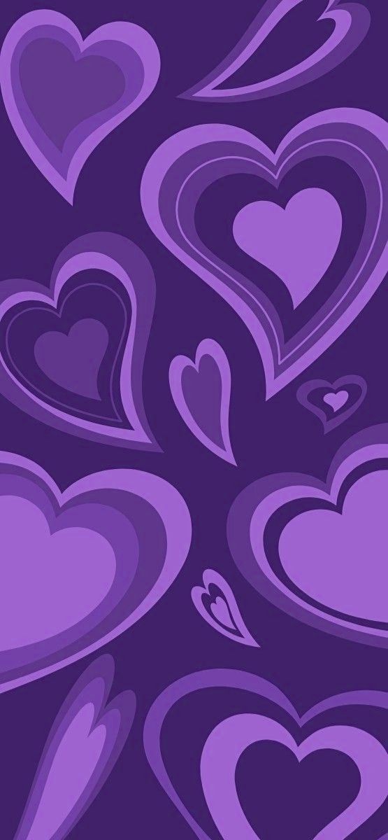 many purple hearts are arranged in the shape of heart shapes on a dark blue background