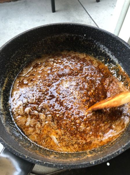 a pan filled with food on top of a stove