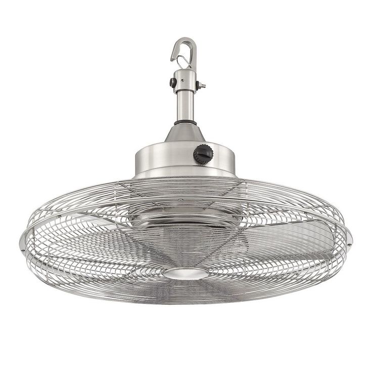 an industrial style light fixture with a metal cage on the side and a white background