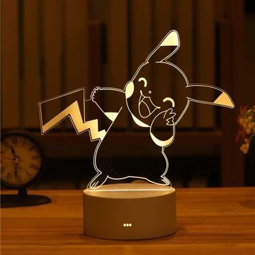 an image of a light up figure on a table with a clock in the background