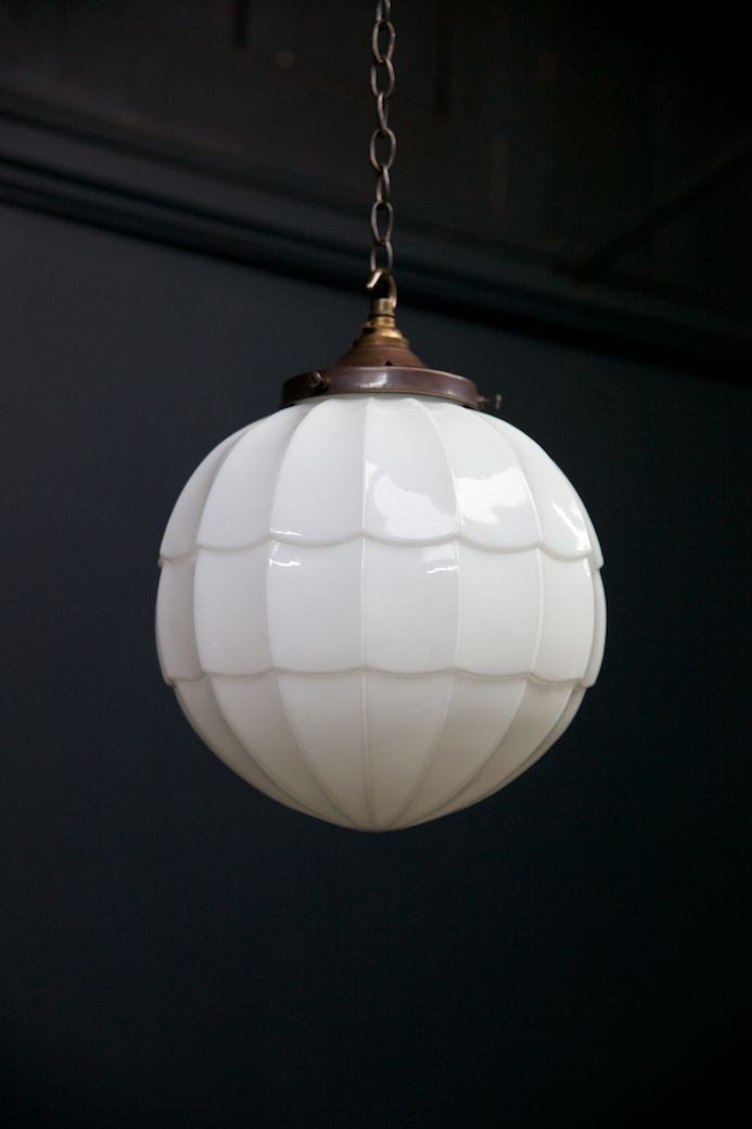 a white light hanging from a ceiling with the words fluted opalines on it