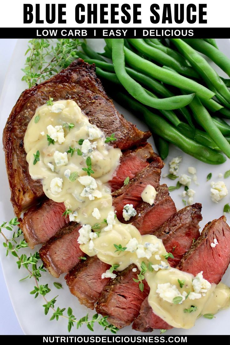 blue cheese sauce on top of steak with green beans