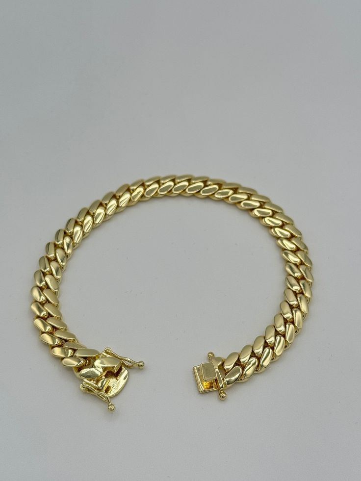 Cuban Link Bracelet Chain 14K Gold Plated Solid Handmade Item Jewelry Miami Style, Gift Birthday Fathers Day Anniversary, HipHop Indulge in the timeless elegance of our Cuban link chains and bracelets, meticulously handcrafted to perfection. Each piece is a solid statement of craftsmanship, created with passion and precision. Our Cuban link collection is plated not once, not twice, but five times with a lavish 14K Gold polish, ensuring a radiant and opulent finish that exudes sophistication. Emb Elegant Luxury Engraved Cuban Link Bracelet, Luxury Gold Cuban Link Bracelet With Diamond Accents, Luxury Gold Plated Cuban Link Bracelet Classic Style, Luxury Gold-plated Rectangular Jewelry, Luxury Gold Cuban Link Bracelet, Luxury Rectangular Gold-tone Jewelry, Gold Chain Bracelet For Anniversary, Gold Cuban Link Chain Bracelet For Anniversary, Gold 14k Stamped Bracelets For Anniversary