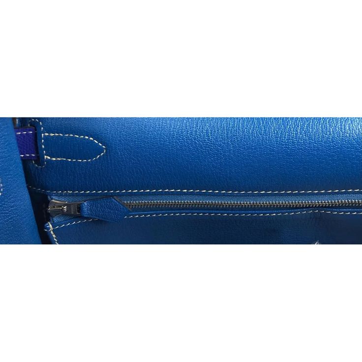 Description: Hermès Kelly 32 blue electric epsom leather handbag From the Candy Collection Palladium hardware Plastic on hardware Height: 9" Depth: 4" Length: 12.5" Reference number: LU1826214033852 (1stDibs) Seller Location is in Miramar, Florida Shipping Location is in Miami, Florida A return for this item may be initiated within 1 day of delivery Experienced sellers undergo a comprehensive evaluation by our team of in-house experts This item is priced in the lower range of recent sales of sim Designer Blue Shoulder Bag With Leather Lining, Designer Blue Shoulder Bag For Business, Blue Top Handle Shoulder Bag With Leather Lining, Blue Business Shoulder Bag With Palladium Hardware, Blue Shoulder Bag With Palladium Hardware For Office, Designer Blue Satchel For Travel, Luxury Blue Satchel With Palladium Hardware, Luxury Blue Satchel With Silver-tone Hardware, Blue Rectangular Satchel With Palladium Hardware