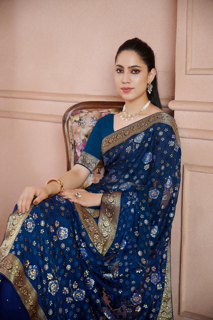 Kamini Georgette Half & Half Stone Work Brocade Border Saree Soft easy to wear georgette fabric. Beautiful floral print with stone Brocade border Comes with unstitch blouse fabric. Effortlessly elegant and versatile, the Mahi Saree is the perfect addition to any wardrobe. Made from soft and lightweight Georgette fabric, it features a stunning floral print and intricate brocade border. Transitional Blue Georgette Blouse Piece, Festive Georgette Sets With Bandhani Print, Festive Georgette Saree With Printed Border, Festive Bandhani Print Georgette Sets, Traditional Georgette Blouse Piece With Printed Border, Elegant Designer Wear Dupatta With Bandhani Print, Fitted Georgette Sets With Bandhani Print, Elegant Bandhani Print Dupatta For Designer Wear, Unstitched Georgette Saree