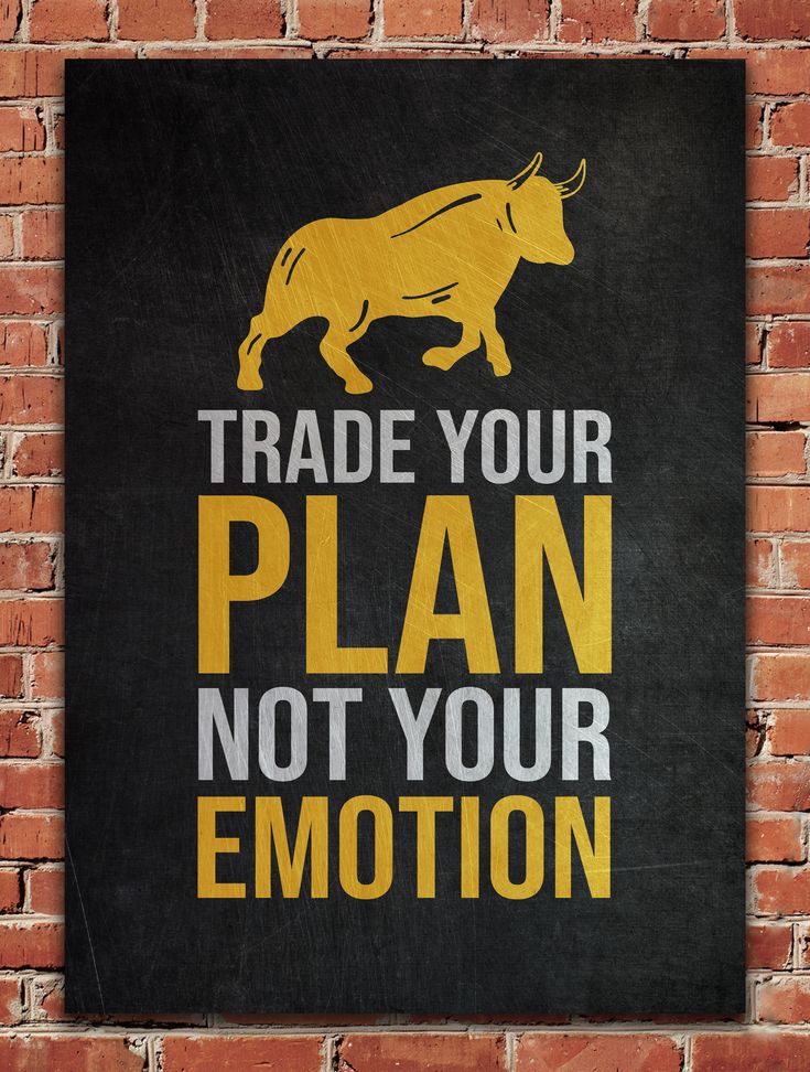 a sign that says trade your plan not your emotion on a brick wall in front of a red brick wall